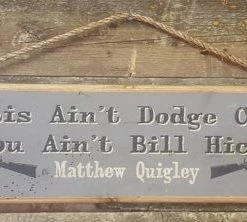 OutWest Shop Decor Wall Sign Movie Quote: Matthew Quigley. This Ain't Dodge City And You Ain't Bill Hickock
