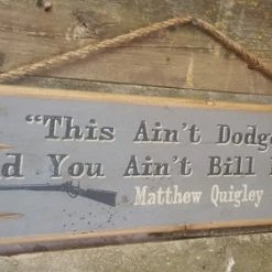 OutWest Shop Decor Wall Sign Movie Quote: Matthew Quigley. This Ain't Dodge City And You Ain't Bill Hickock