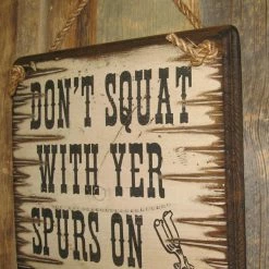 OutWest Shop Decor Wall Sign Advice: Don't Squat With Yer Spurs On